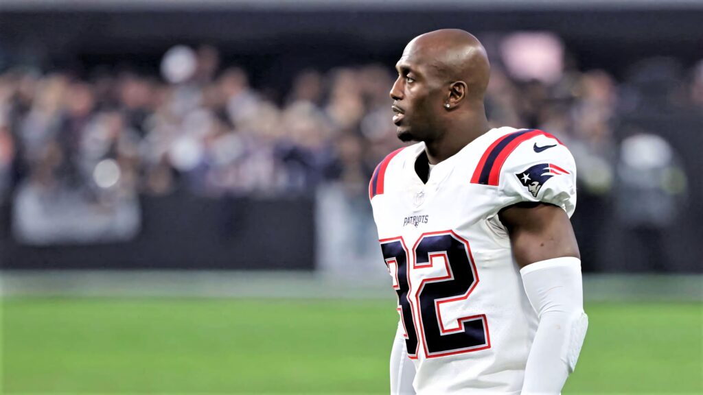 Devin McCourty in New England Patriots uniform focused on field vibrant HD wallpaper background