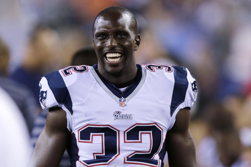 Devin McCourty in New England Patriots uniform showing intensity and athleticism on field Wallpaper