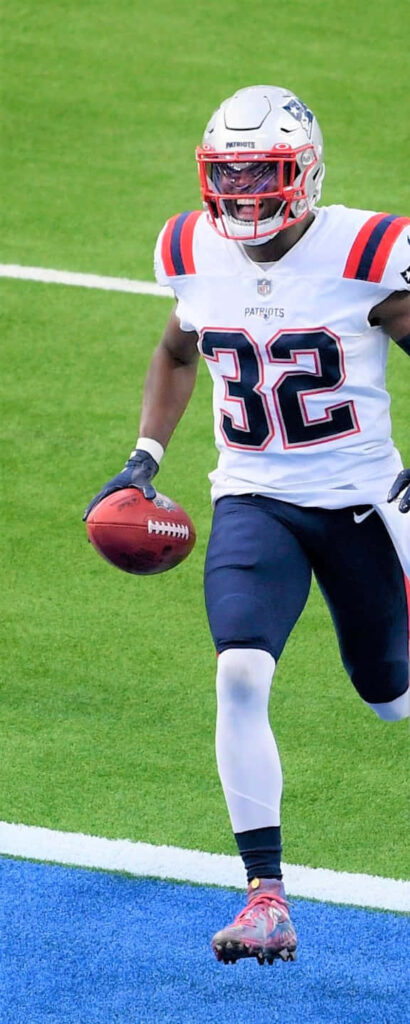 Devin McCourty New England Patriots action shot showing agility and determination on field Wallpaper