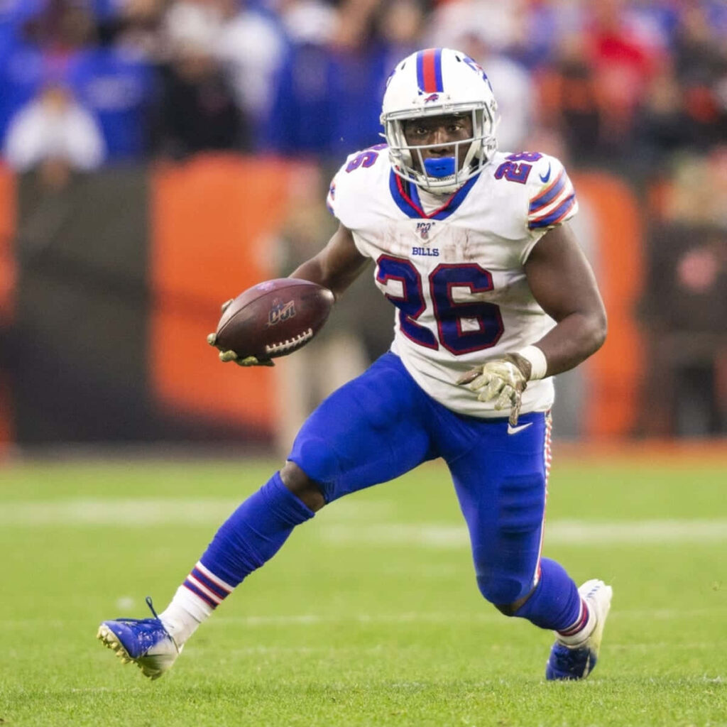 Devin Singletary Buffalo Bills running back in action vibrant team colors stadium background wallpaper