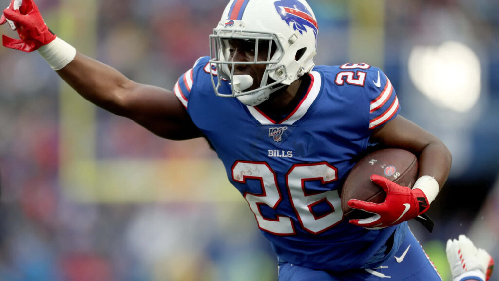 Devin Singletary Buffalo Bills running with football in blue red uniform stadium background wallpaper