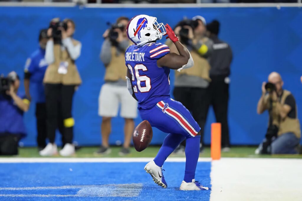 Devin Singletary Buffalo Bills touchdown celebration packed stadium NFL excitement wallpaper