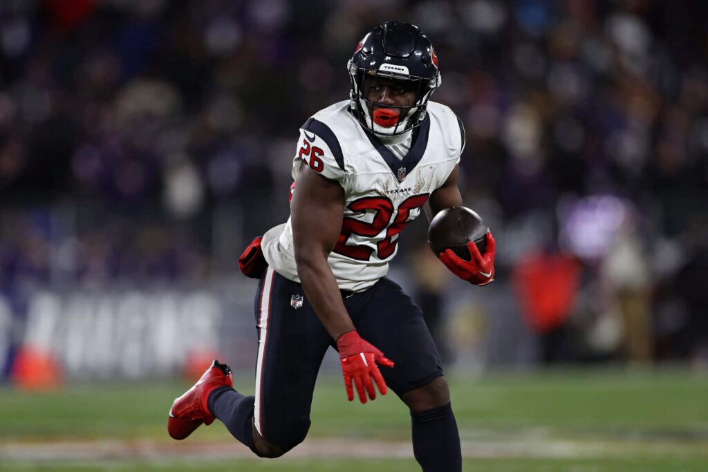 Devin Singletary Houston Texans running back powerful burst down field dynamic NFL action wallpaper