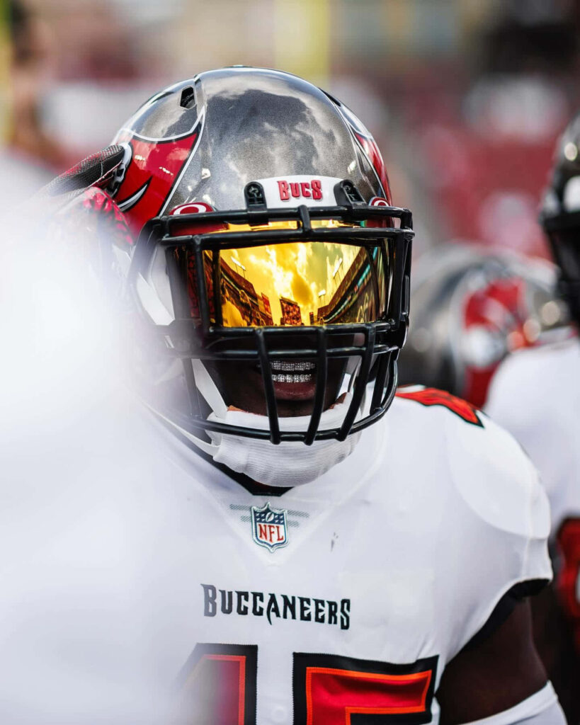 Devin White Buccaneers linebacker in action with reflective helmet bold gold visor NFL wallpaper