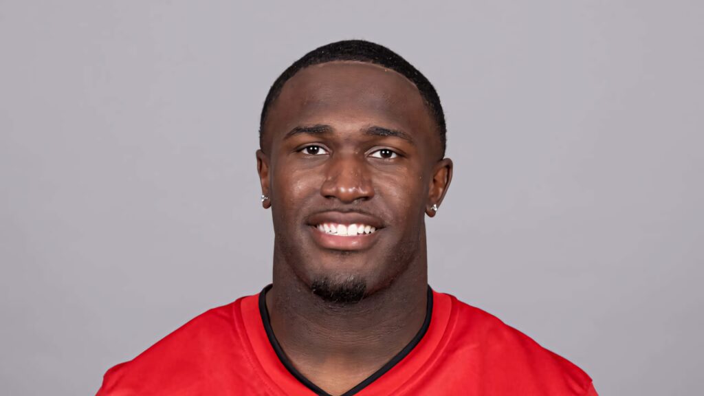 Devin White NFL headshot in red jersey on gray background confident athletic portrait wallpaper