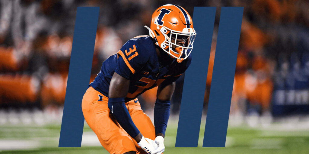 Devon Witherspoon Illinois Football in orange navy uniform intense action wallpaper background