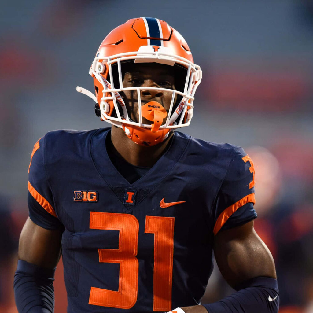Devon Witherspoon in Illinois football uniform number 31 navy orange vibrant college football wallpaper