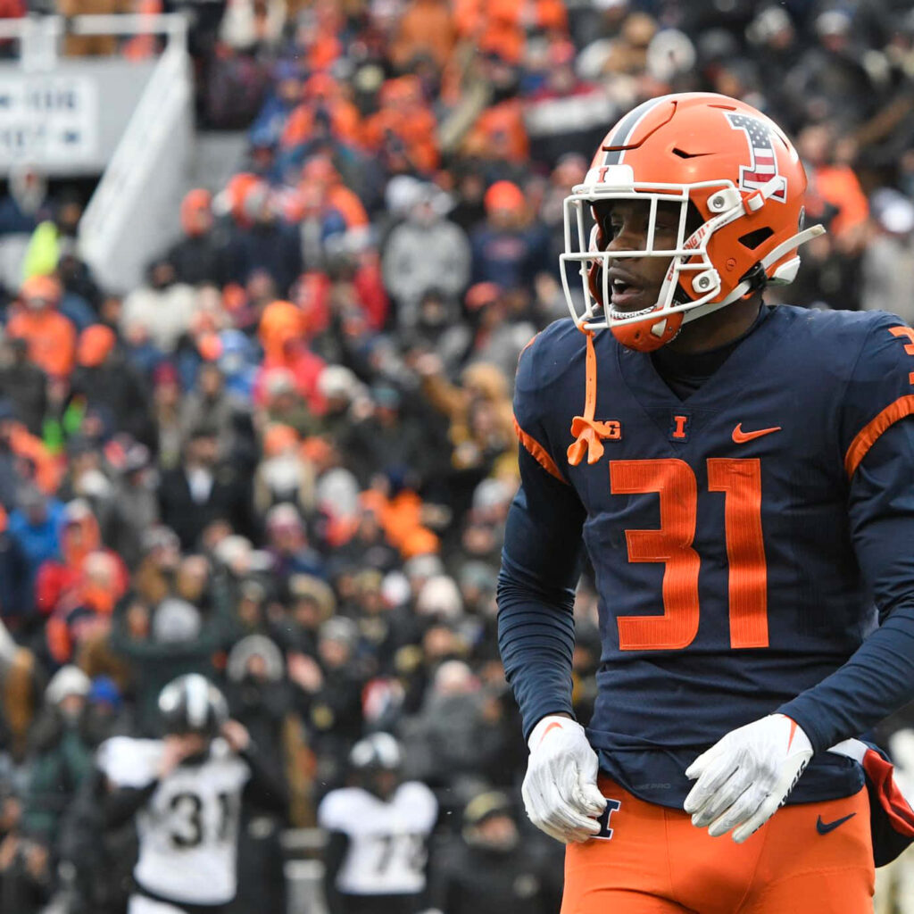 Devon Witherspoon in number 31 jersey focused on field vibrant orange navy game day wallpaper