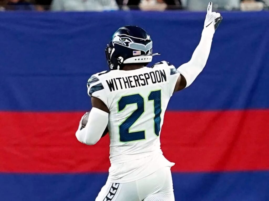 Devon Witherspoon Seattle Seahawks celebrating in number 21 jersey with vibrant team colors wallpaper