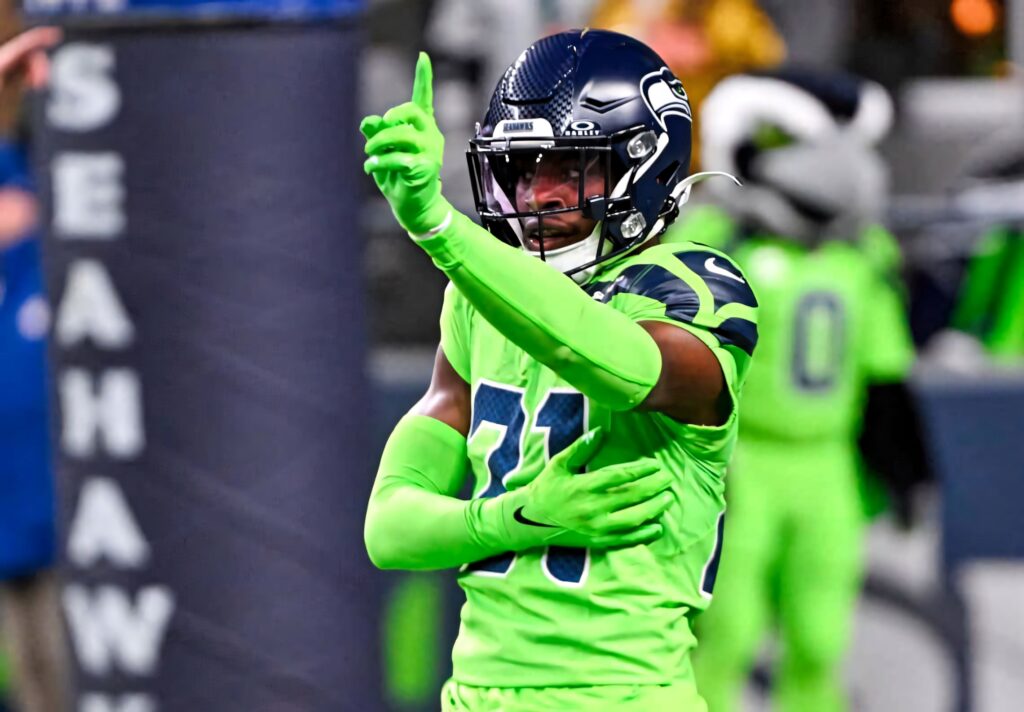 Devon Witherspoon celebrating victory in neon green Seattle Seahawks uniform high resolution wallpaper