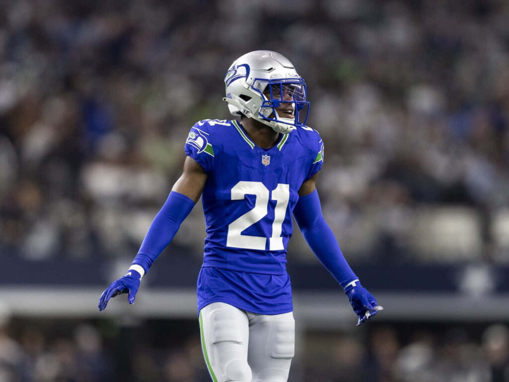 Devon Witherspoon Seahawks number 21 in action focused athletic pose NFL football wallpaper background