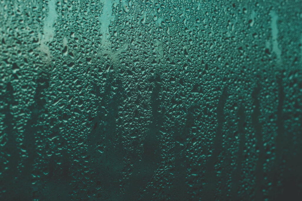 Dancing Rain: Captivating Liquid Drops on Glass Surface - HD Wallpaper Background