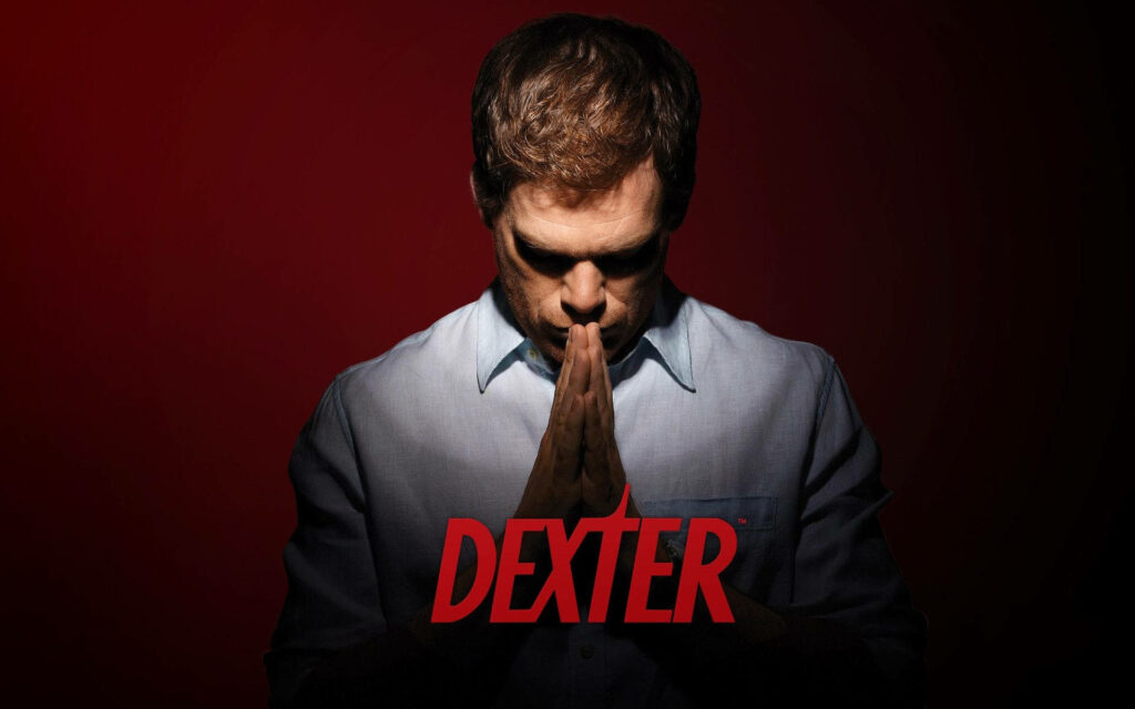 Michael C Hall as Dexter Morgan in intense red background with contemplative pose wallpaper