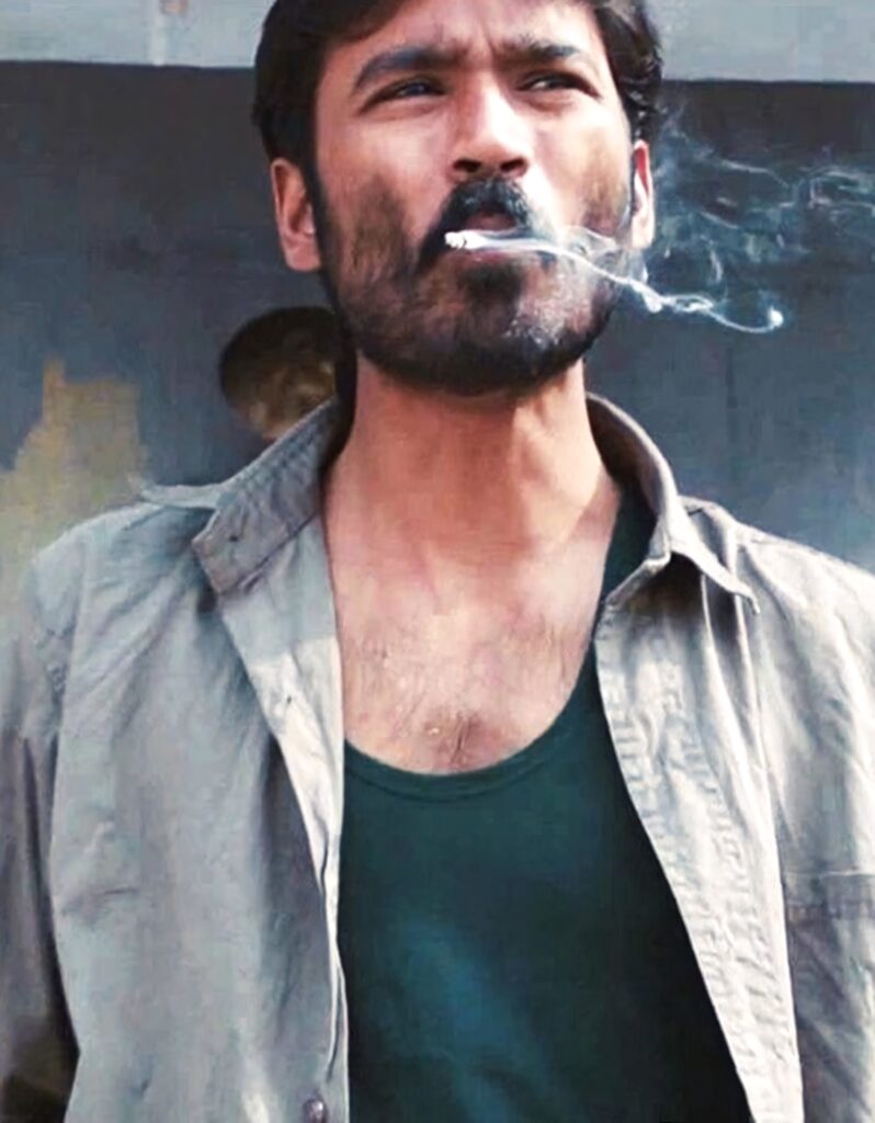 Dhanush rugged look smoking cigarette casual shirt dark vest cinematic natural lighting wallpaper