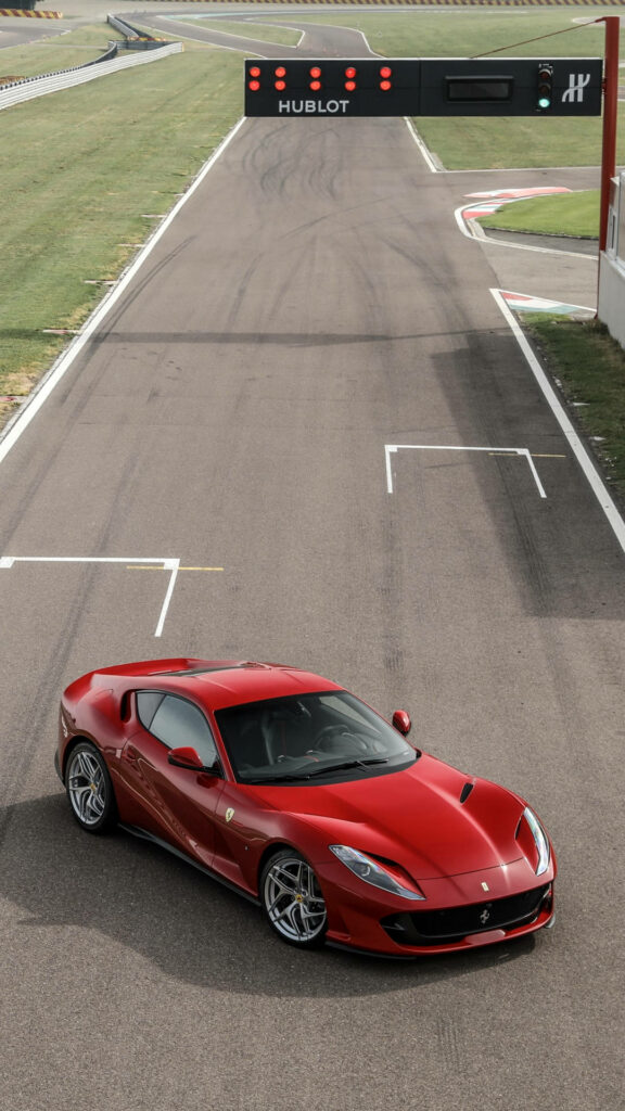 Unleashing Power: The Iconic 2017 Ferrari 812 Superfast Roars on the Racing Track Wallpaper