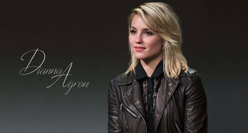 Dianna Agron in leather jacket with flowing blonde hair on minimalist dark background wallpaper