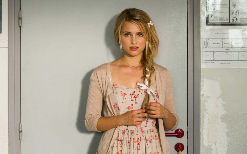 Dianna Agron in flamingo print dress and light cardigan with braided hair and pink ribbon Wallpaper