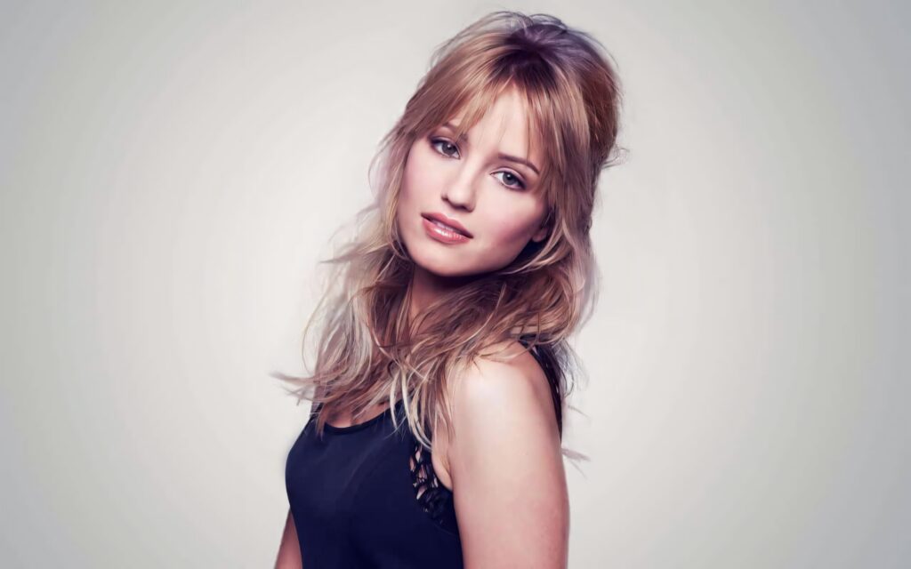 Dianna Agron portrait with tousled blonde hair soft lighting and muted gray background wallpaper