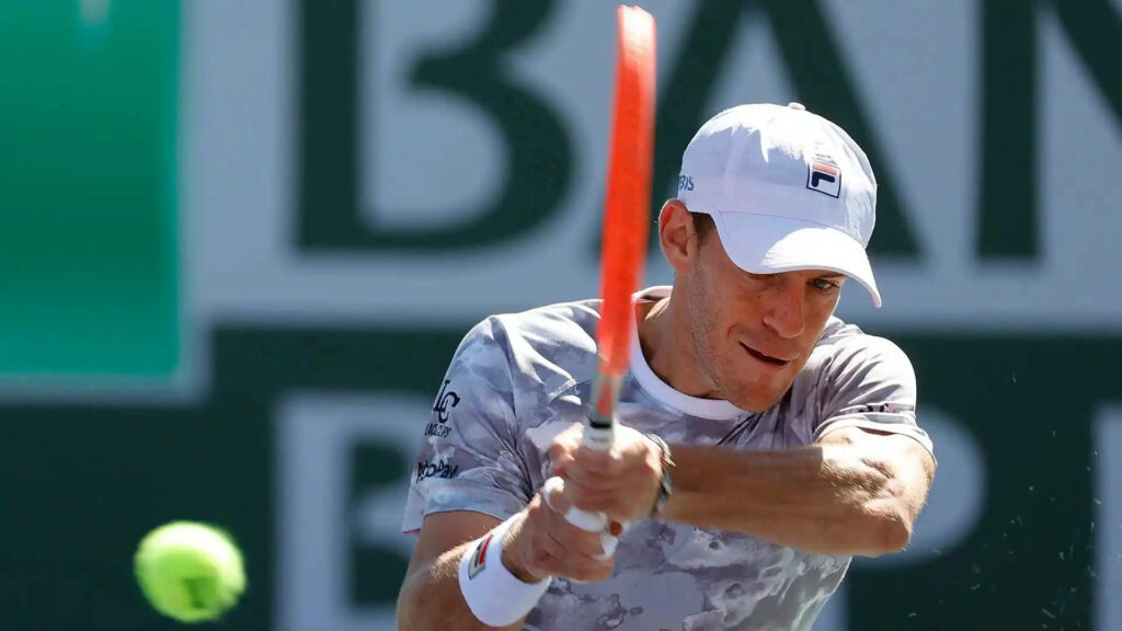 Tennis player Diego Schwartzman poised to return fast ball showcasing athletic energy wallpaper