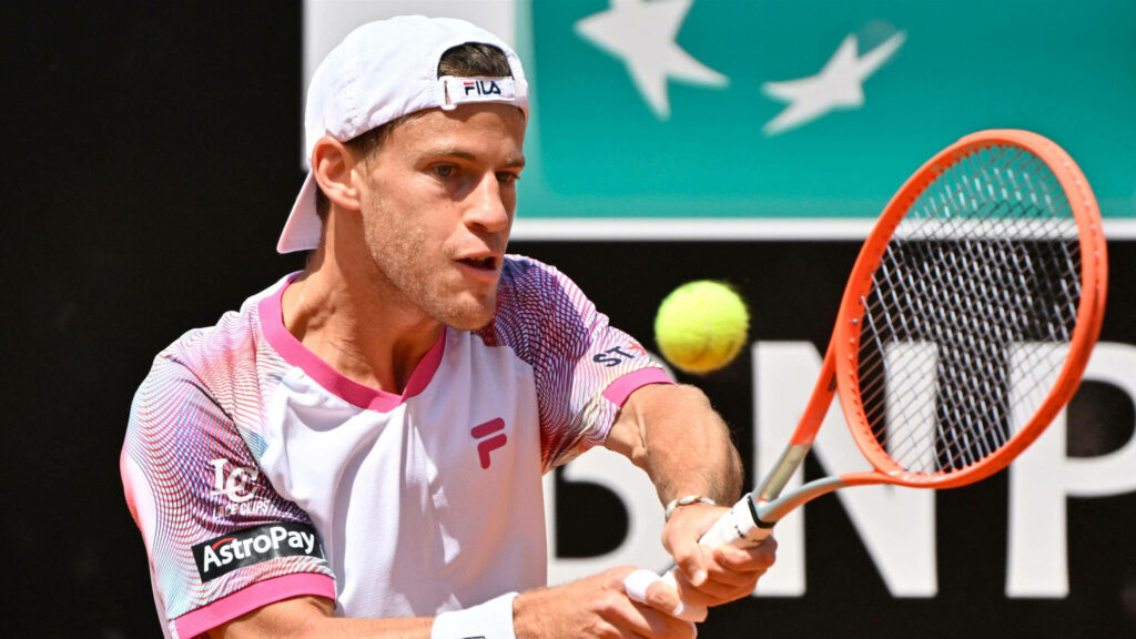 Diego Schwartzman two-handed backhand tennis shot vibrant white pink outfit intense focus action Wallpaper