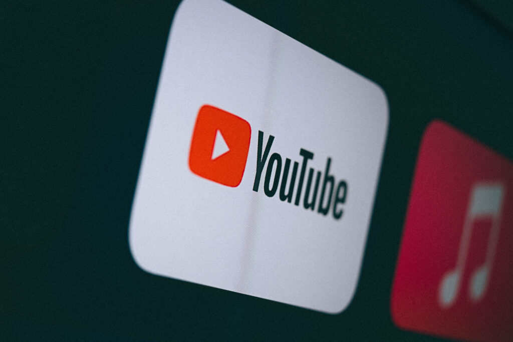 Recognizable YouTube App Logo as a Striking Background Image Wallpaper