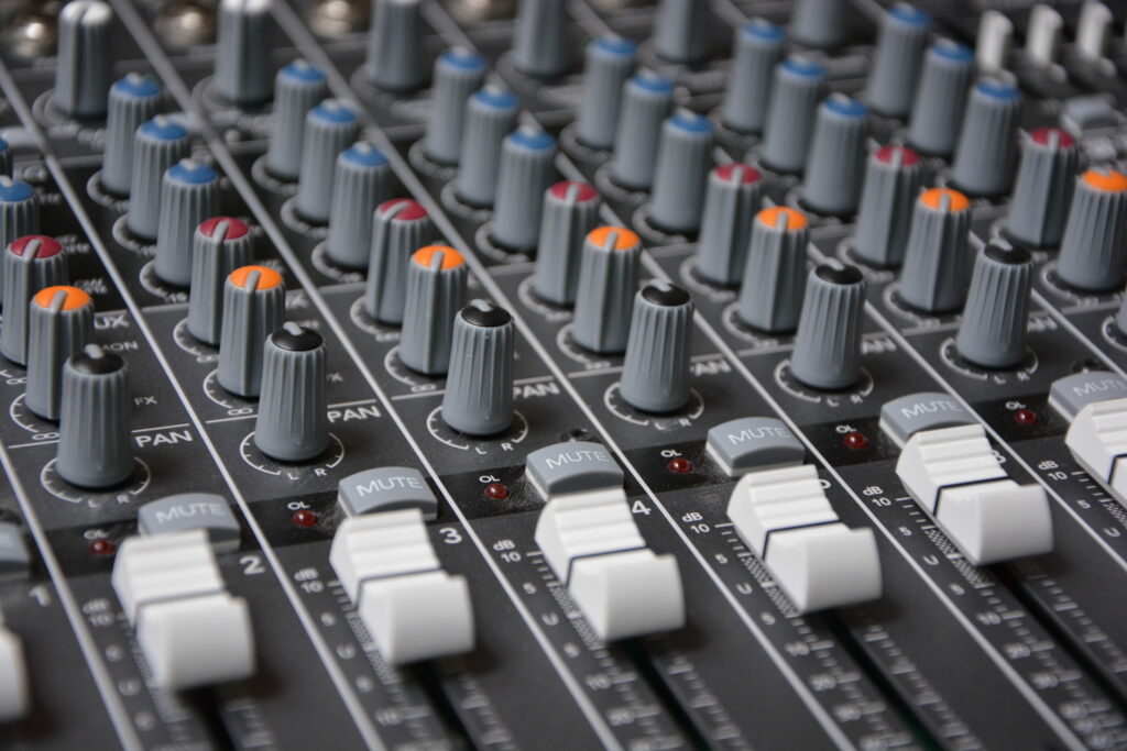 Analog Meets Digital: Macro Shot of Gray Studio Mixer as Audio Controller in Wallpaper