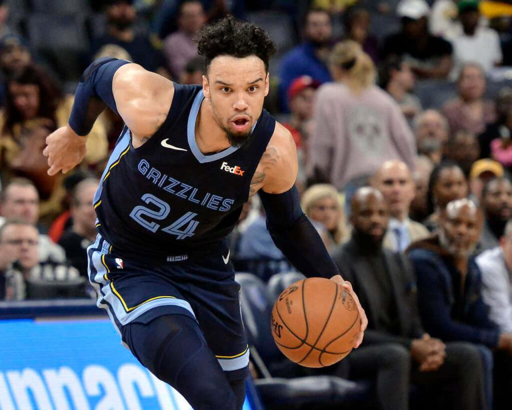 Dillon Brooks dribbling fast in Memphis Grizzlies uniform showing intense focus and energy Wallpaper