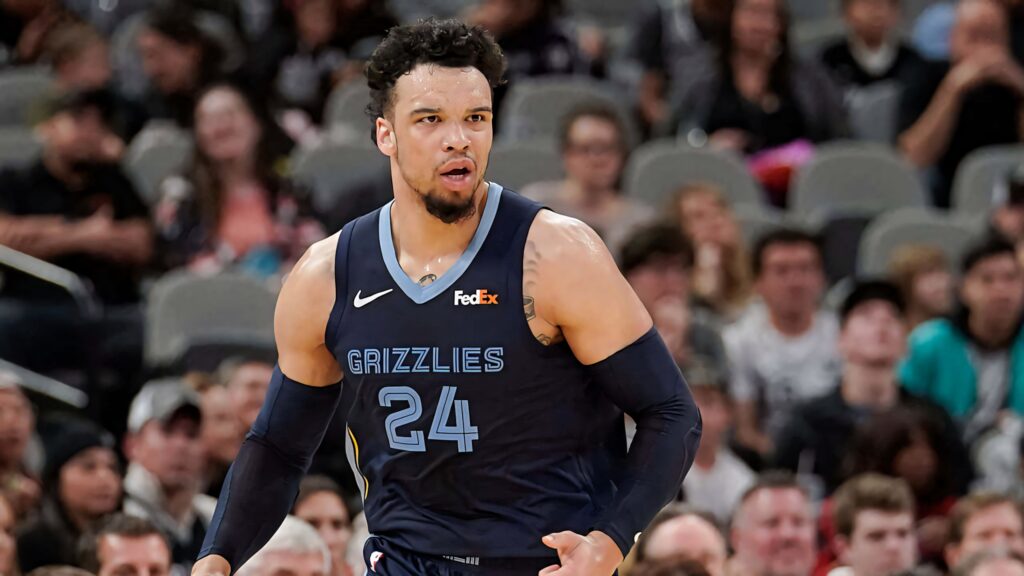 Dillon Brooks Memphis Grizzlies basketball action shot focused intense game dynamic crowd background Wallpaper