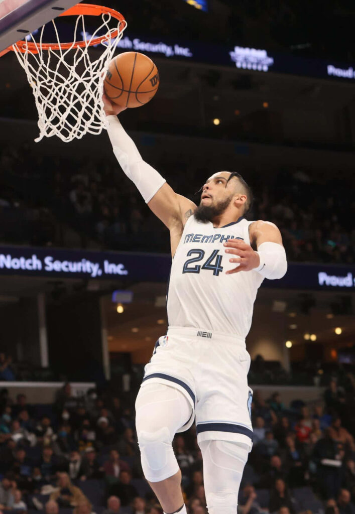 Dillon Brooks Memphis Grizzlies number 24 driving layup mid-air intense basketball action shot Wallpaper