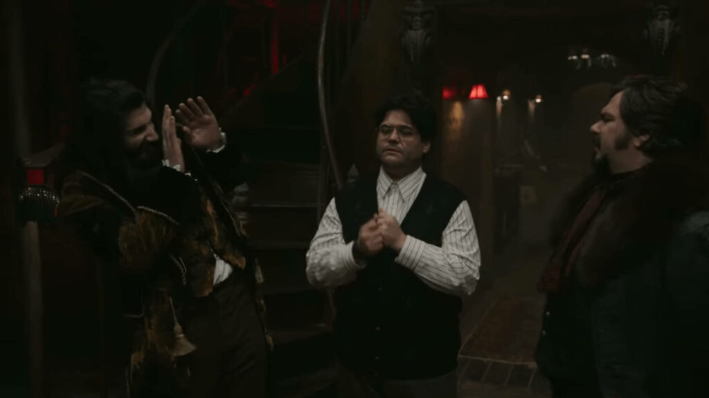 What We Do In The Shadows: Dimly Lit Interior with Characters Wallpaper