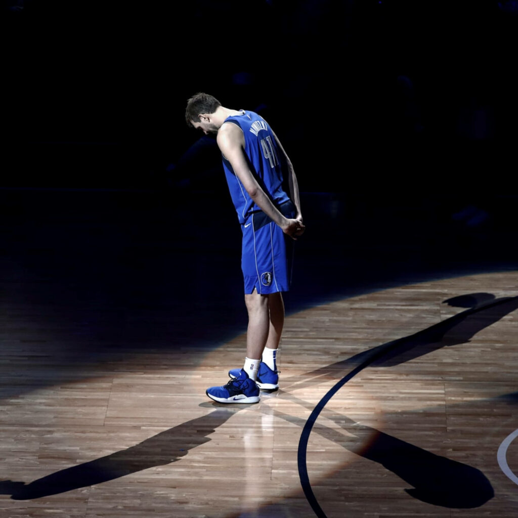 Dirk Nowitzki retirement wallpaper NBA icon spotlight Dallas Mavericks reflective moment