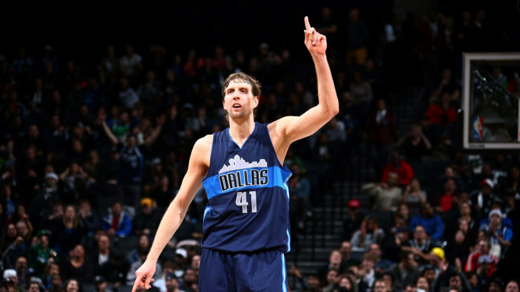 Dirk Nowitzki Dallas Mavericks number 41 shooting pose vibrant basketball arena wallpaper