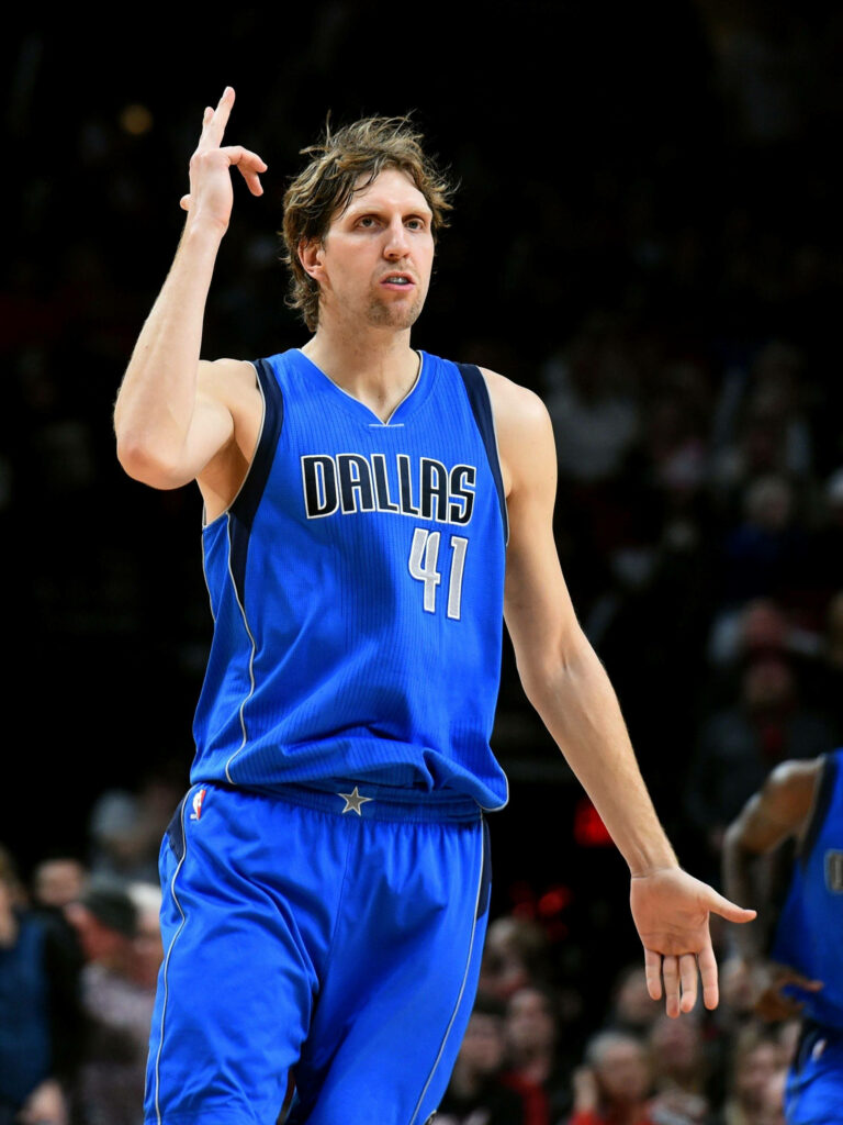 Dirk Nowitzki Dallas Mavericks number 41 basketball wallpaper dynamic court action blue background