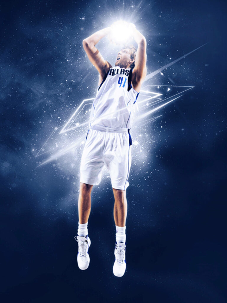 Dirk Nowitzki performing iconic fadeaway shot with glowing basketball on blue dynamic background Wallpaper