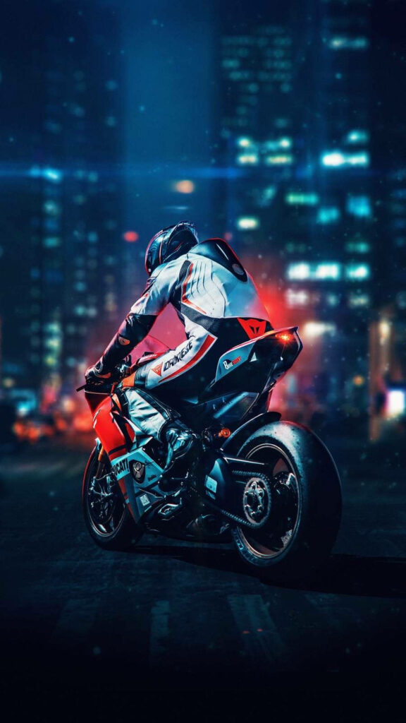 Dirt bike rider on Ducati in sleek suit against neon cityscape at night urban racing wallpaper