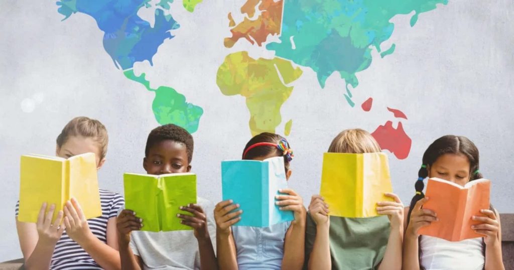 Five diverse children reading colorful books with world map background education wallpaper
