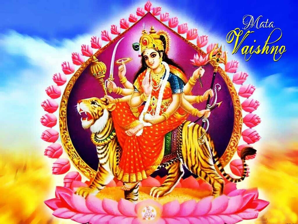 The Majestic Vaishno Devi: Goddess' Power Embodied on a Ferocious Tiger, Enveloped by a Blooming Lotus Wallpaper