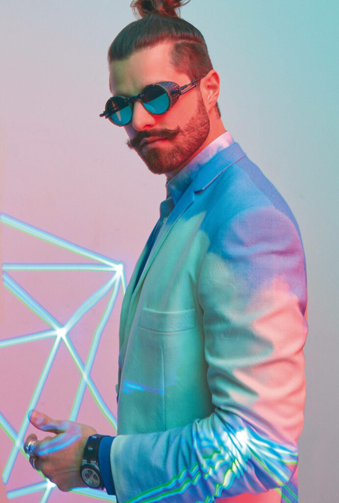 Dj Alok, the Dapper Master of Free Fire, Flaunting a Vibrant Pastel Tuxedo Wallpaper