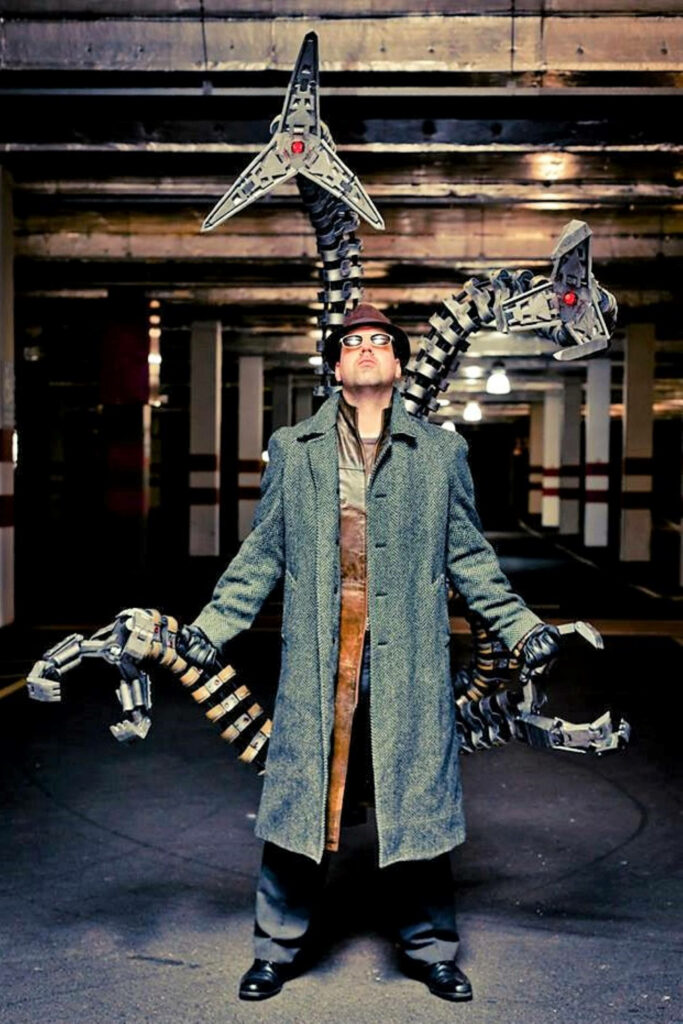 Doctor Octopus cosplay with mechanical tentacles in gritty underground setting dramatic lighting Wallpaper