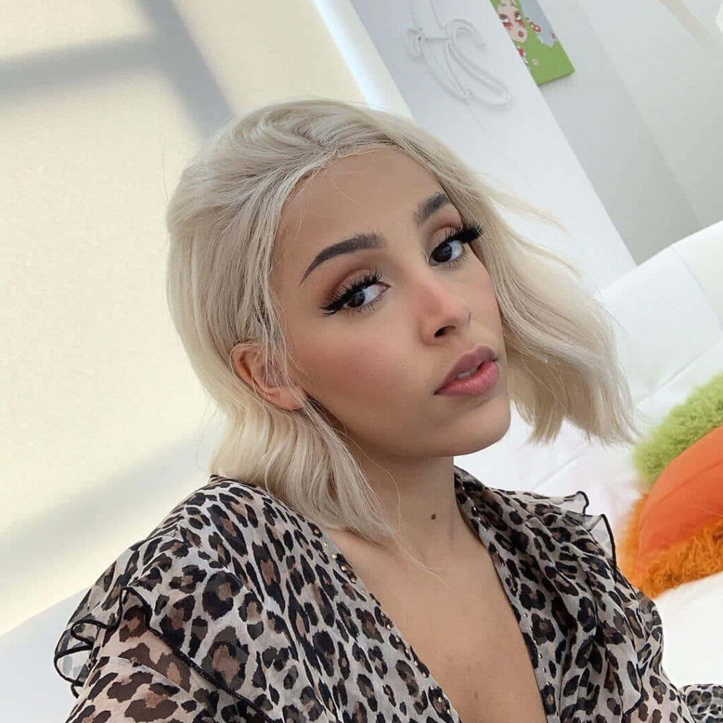 Doja Cat's Elegant Leopard Print Outfit - Stunning Wallpaper Background