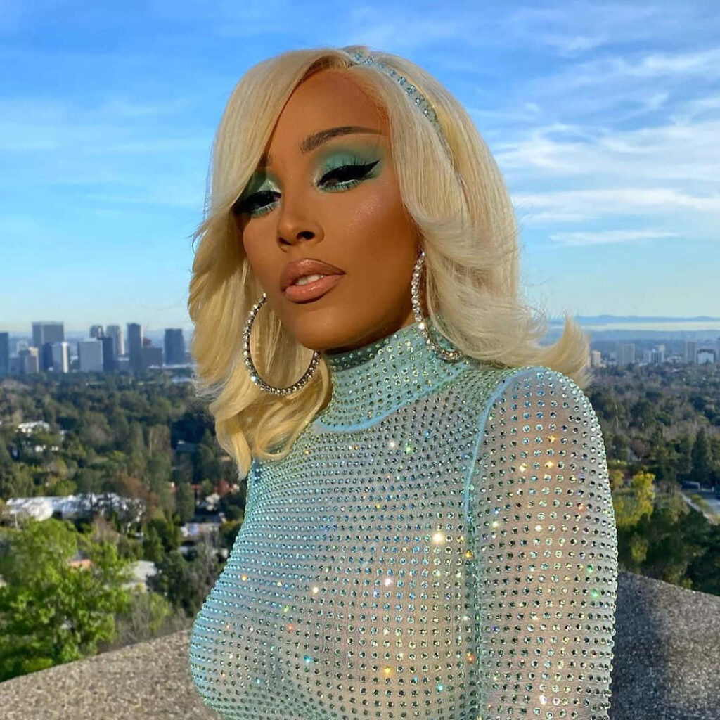 Doja Cat Glam Wallpaper: Sparkling Outfit & Cityscape Background