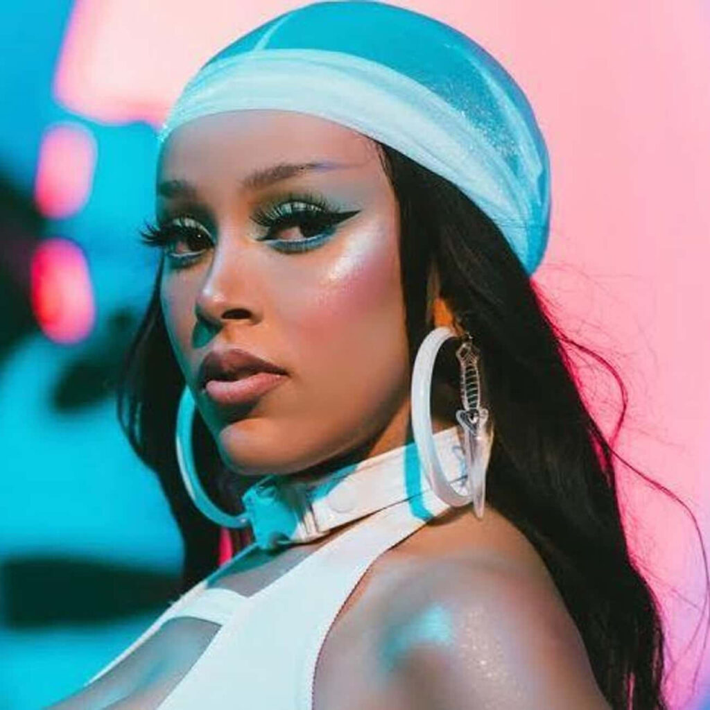 Doja Cat's Vibrant Style: Confident Makeup & Bold Accessories Wallpaper