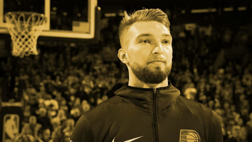 Domantas Sabonis courtside basketball wallpaper with yellow filter and intense arena atmosphere