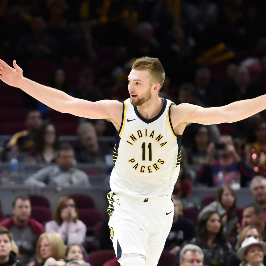 Domantas Sabonis celebrating in vibrant Indiana Pacers arena action wallpaper background