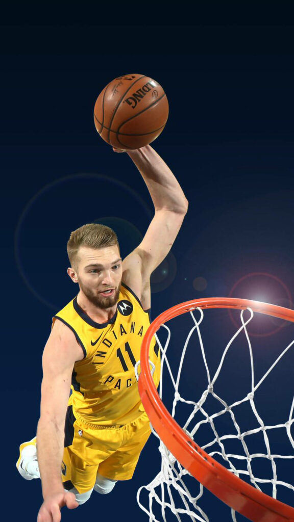 Domantas Sabonis mid-layup in Indiana Pacers jersey dynamic lighting vibrant basketball wallpaper