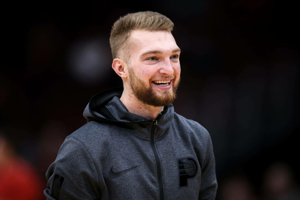 Domantas Sabonis smiling portrait in Indiana Pacers zip-up with blurred background wallpaper