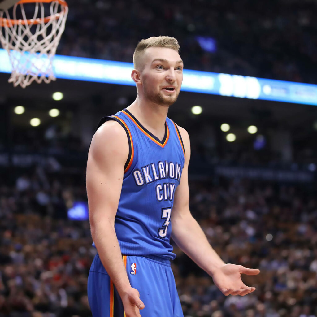 Domantas Sabonis in Oklahoma City Thunder jersey playing basketball intense game action wallpaper