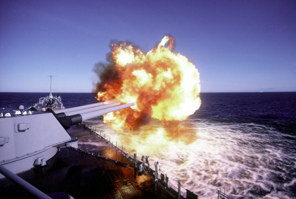 Naval Power Unleashed: Majestic War Ship showcasing its Arsenal Wallpaper