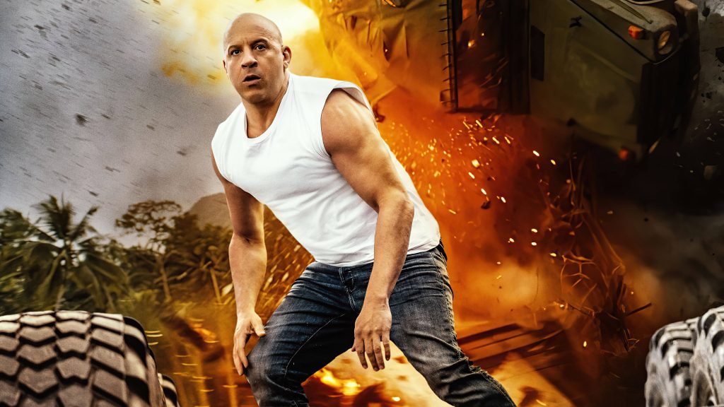 Vin Diesel as Dominic Toretto crouched in fiery explosion tropical Fast and Furious wallpaper