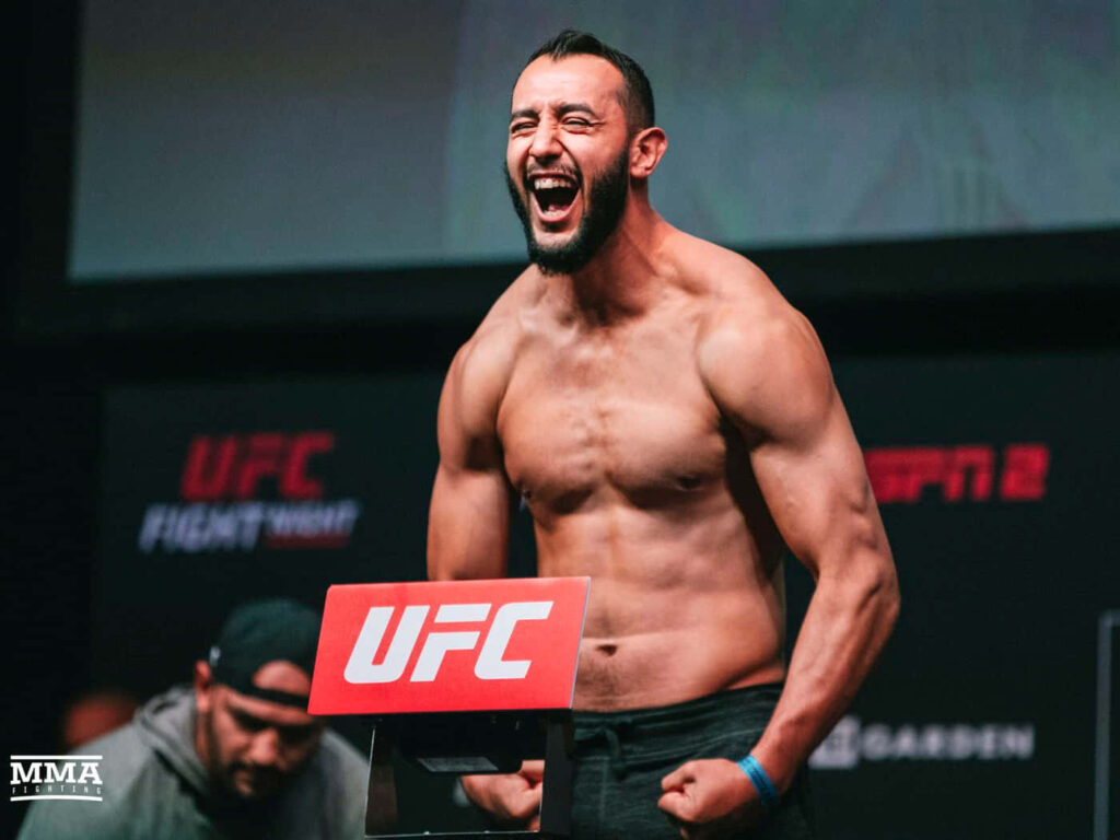 Dominick Reyes shirtless UFC weigh-in stage showing muscular physique and intense energy Wallpaper
